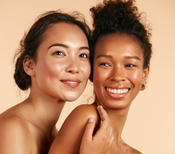 2 women with glowing skin