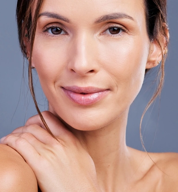 Middle age woman with smooth skin because of Daxxify treatment