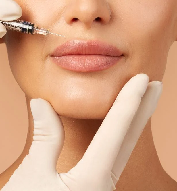 Woman receiving lip filler