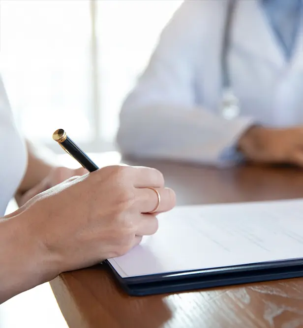 patient filling out medical forms